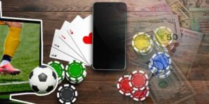 A mobile phone surrounded by poker chips, playing cards, and sports betting elements symbolizing wagering requirements