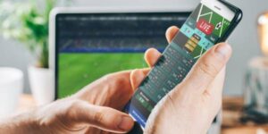 User experience of manual betting on a smartphone compared to automated bot betting operations.