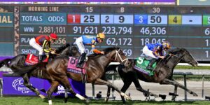 Horse racing action at Breeders Cup with odds board highlighting exotic bets opportunities.