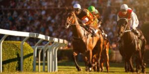 Horse racing action with jockeys leading the field, symbolising the thrill of exotic bet payout opportunities.