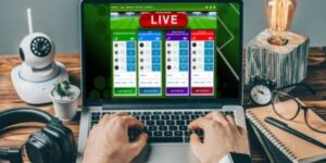 User placing live bets on a laptop with Sports Maximiser by Imperial Wealth betting for automated betting.