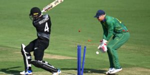 Batsman bowled out as stumps are shattered during a professional cricket match, action moment relevant to cricket betting markets