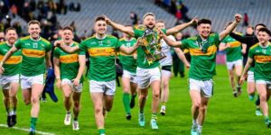 Gaelic football players celebrating on the pitch after winning a trophy