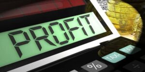 Betting profit calculator showing coins, tax buttons, and a digital screen displaying profit.