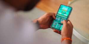 Dutching strategy shown on a mobile sports betting app with live odds and multiple betting options.